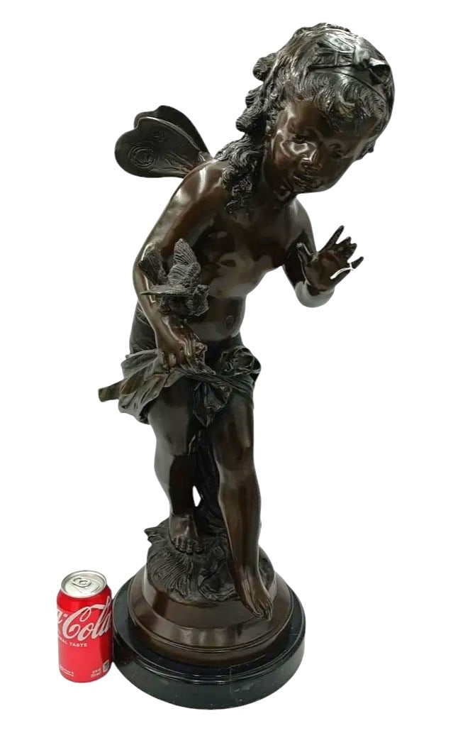After Auguste Moreau's French Bronze Sculpture 29in: After Auguste Moreau (French: 1813 - 1947) Art Nouveau bronze sculpture depicting a fairy with wings alongside a bird. Signed "Auguste Moreau" to side of bronze base. Mounted on a black marble plinth.