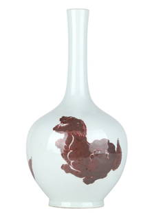 Chinese Kangxi Porcelain Buddhist Lions Vase: A stunning Chinese vase from the Kangxi period, featuring reticulated hand-painted copper red Buddhist lions. The vase exhibits a classic elongated neck and a bulbous body, characteristic of the era.