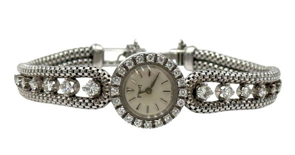 Antique Piaget Art Deco 18K White Gold & 1ctw Diamond Watch: Lady's 18k white gold Piaget Deco watch, comprised with a round case & (20) round diamonds in the bezel, this watch also has a woven graduating mesh double strand bracelet set with (8) round diamonds