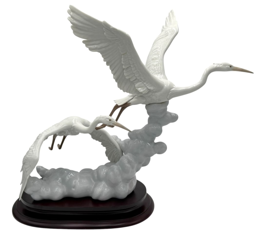 Rare Lladro Porcelain 'Cranes In Flight' #6433: Spanish Name: Garzas al Vuelo. Sculptor: Salvador Debon. Year Issued: 1997. Year Retired: 2001. Dimensions: 21-3/4 x 21-1/4in. Last Retail: $1,390.00