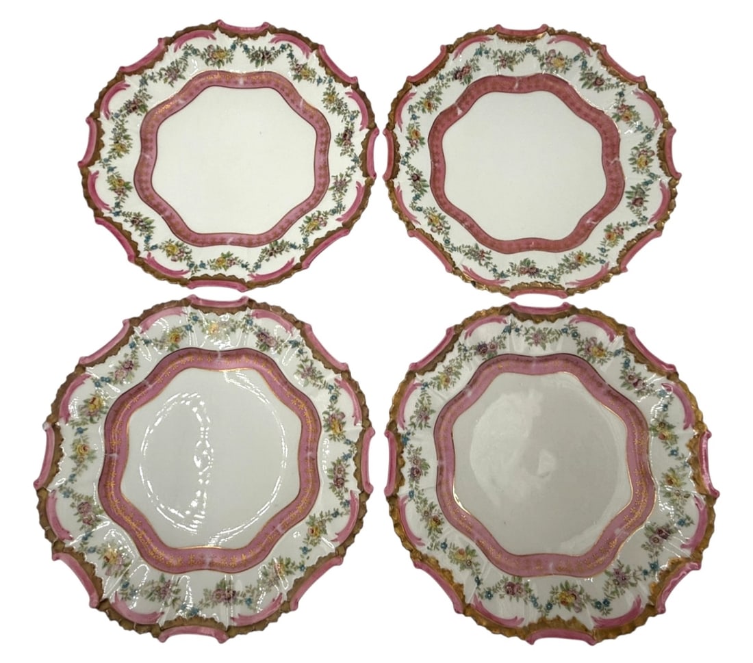 Higgins & Seiter Limoges Porcelain Plates, 1890s: A set of exquisite porcelain plates by Higgins & Seiter, crafted in Limoges, France during the late 19th century. These plates are adorned with a delicate floral design featuring a pink border and gol