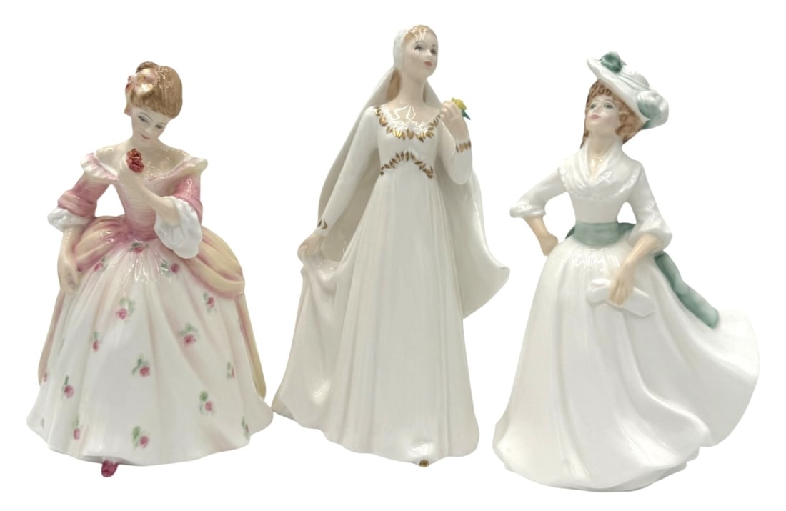 Royal Doulton Figurines by Peggy Davies: These elegant Royal Doulton figurines, modeled by Peggy Davies, are exquisite examples of fine bone china craftsmanship. The collection includes 'Bride' (HN 2873), 'Margaret' (HN 3496), and an additio