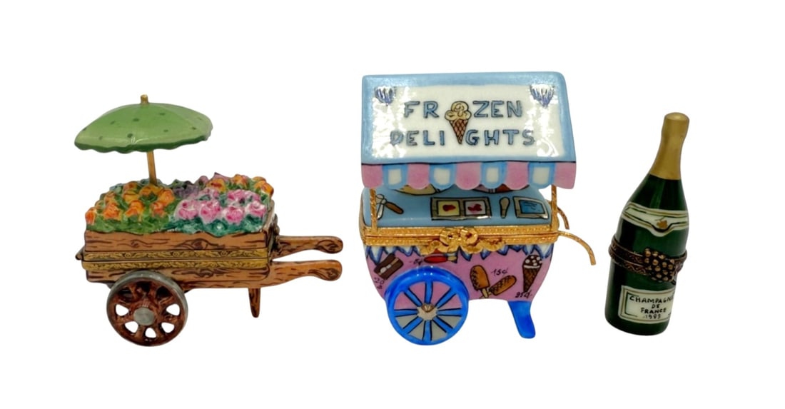 Limoges France Hand-Painted Trinket Boxes Set: Charming set of hand-painted porcelain trinket boxes from Limoges, France. Featuring a floral cart, an ice cream cart labeled 'Frozen Delights', and a champagne bottle marked 'Champagne de France 1993