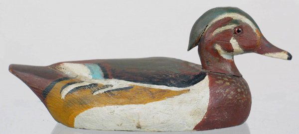 Mini Wood Duck Drake by Schmidt: Colorful wood duck drake with wings and crest carved in relief. Bottom reads in Schmidt's hand, "Wood Duck M". Provenance: William Moore collection