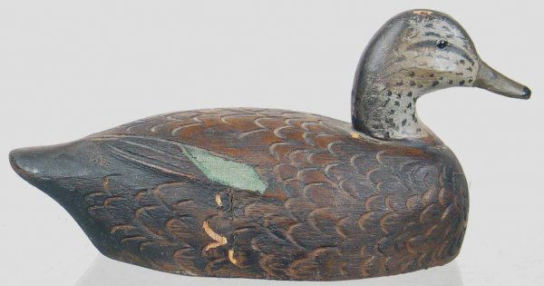 Mini Black Duck by Schmidt.: Black duck with heavily carved feathers and wing detail. In XOC except where nail in top of head is visible. Provenance: William Moore collection