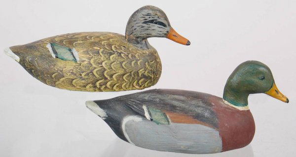 Pair of Mini Schmidt Mallard Decoys: Pair of mini mallards with heavily carved feather detail on hen and carved tail detail on drake. Provenance: William Moore collection