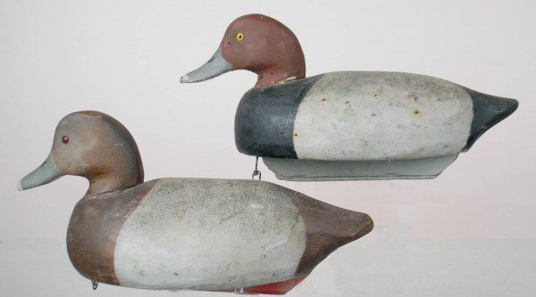 Redhead Pair by F. Schmidt.: Pair of Redhead decoys by Frank Schmidt. In fine OP. Drake lightly hit by shot on left side with a small paint chip and knot showing on right side. Minimal wear to paint. Hen in VG to excellent condit