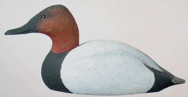 Can Drake in XOC. With Textured Paint: Well carved glass eye canvasback drake. Never rigged. Thick textured paint is all original and in excellent condition. Structurally excellent. Provenance: William Moore collection