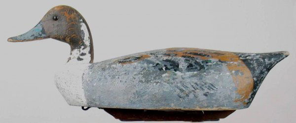 Pair of MI Pintail Decoys Possibly by F. Schmidt.: Pair of Michigan pintails possibly by Frank Schmidt. Appealing form. Remnants of original paint with heavy wear to primer and/or wood over much of both birds. Tight check in back of hen and small chec