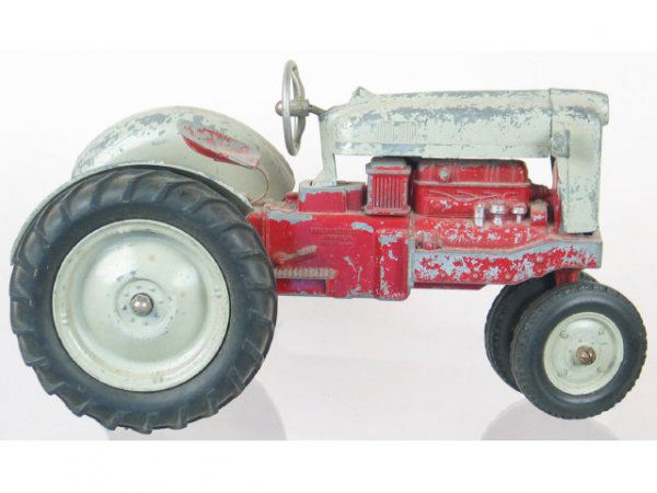 red metal tractor toy