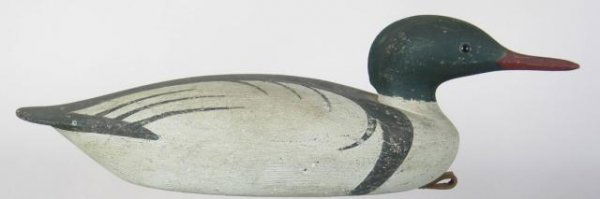 Merganser Drake: Hollow American merganser drake by David Ward in a Martha's Vineyard style. Head turned slightly to the right. Shallow ice groove. Original paint which was aged to appear old with additional shelf wea