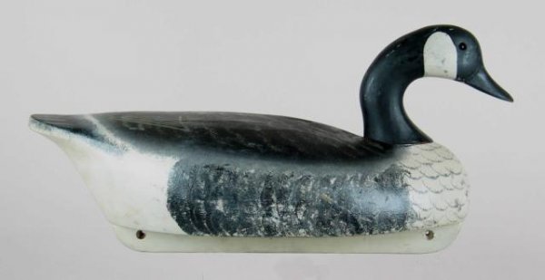 Wildfowler Goose: 14. Wildfowler Canada goose. Balsa with head in swimming pose. Good original paint with a few small rubs to wood or primer at usual high spots. Overall the paint shows light wear. Two or three very sm
