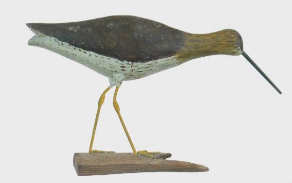 Yellowlegs by Gardner: 770A. Life size feeding or running yellowlegs by Alfred Gardner of Accord (Hingham) MA. Mounted on an old piece of salt water flotsam. Split tail and original bill. Dry original paint with no visible