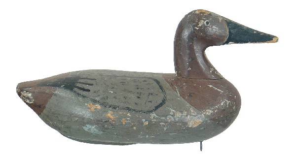 Chesapeake Bay canvasback hen. In a combination of: Chesapeake Bay canvasback hen. In a combination of original and gunning repaint. Some chipping and flaking to surface. Slight separation along vertical seam. 100-200