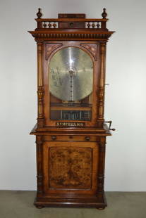 SYMPHONION COIN OP. UPRIGHT DISK (DISC) MUSIC BOX: 84" TALL X 33 1/2" WIDE X 17" DEEP--PLAYER SITS ON CABINET WHICH MAKES IT 2 PIECES--VERY NICE CABINET--HAS 40 25 INCH DISCS--SERIAL NUMBER ON COMB IS 479262-COMB IS IN GREAT CONDITION--PLAYS WELL