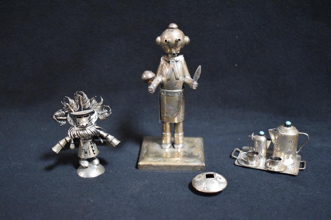 LOT OF NATIVE AMERICAN MINIATURE SILVER ITEMS: THE LOT INCLUDES A SIGNED JEFFERY CASTILLO STERLING KACHINA, A SIGNED HOWARD SICE STERLING MINIATURE OLLA POT, A SIGNED ELIZABETH MARGARET WHITMANN (E.M.F.) NAVAJO STERLING MINIATURE TEA SET, & A SIGN