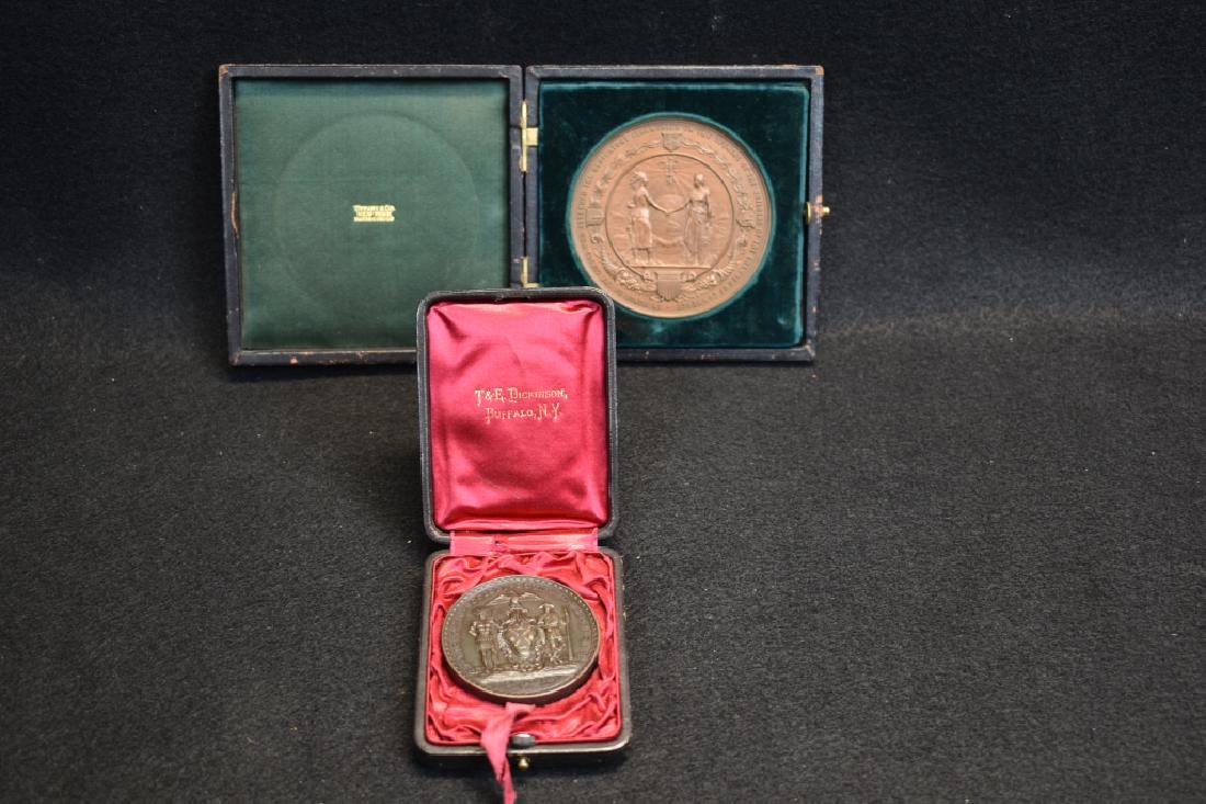 2 TIFFANY & COMPANY BRONZE MEDALLIONS: 2" DIAMETER ONE IS MARKED NEW YORK ST. NICHOLAS SOCIETY 1903--3" DIAMETER ONE IS MARKED CHAMBER OF COMMERCE NEW YORK NOV. 11TH 1902--BOTH IN FELT LINED HOLDERS--BOTH MARKED TIFFANY & CO. ON EDGE