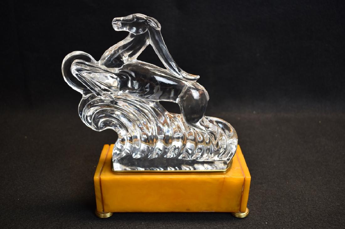 STEUBEN LUMINOR GAZELLE ON BAKELITE BASE: 8 3/4" TALL X 6 7/8" LONG BASE--BASE LIGHTS WITH A SMALL BULB--GAZELLE IS SIGNED STEUBEN ON BASE--2 CRACKS TO BAKELITE