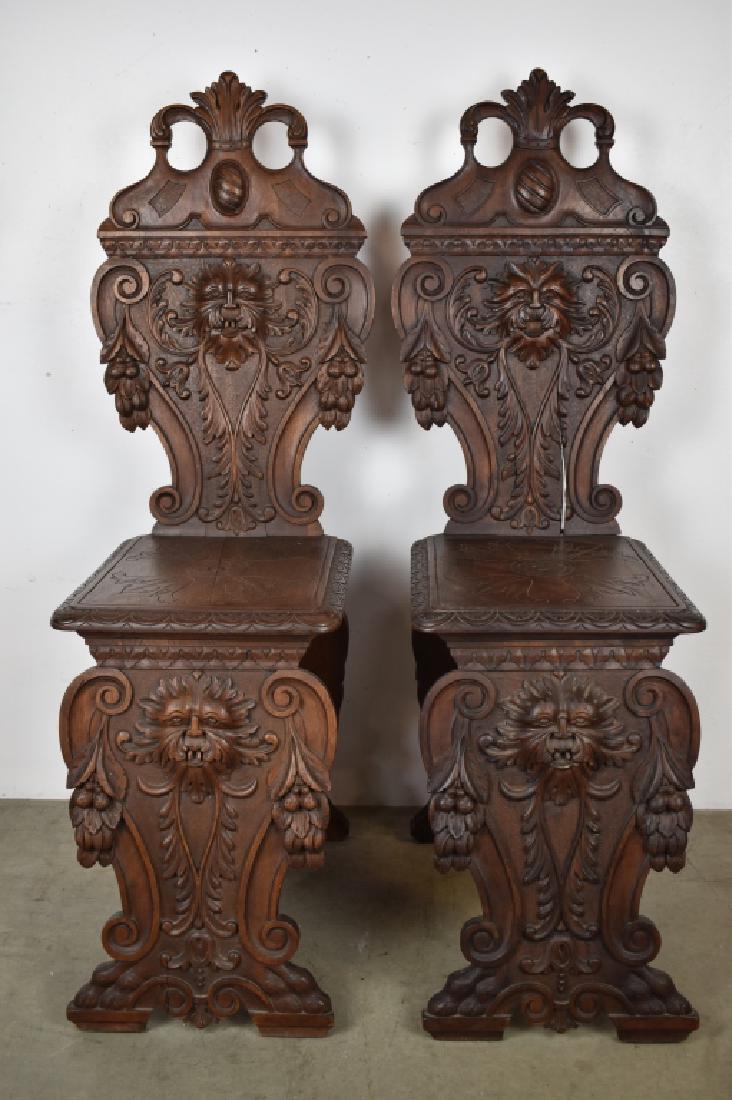 PAIR 1900'S CARVED WALNUT LION CHAIRS: 41 1/2" TALL--HAS NICE LION & CLAW FOOT CARVING--ONE DOES HAVE A SPLIT IN BACK (SEE PHOTOS)