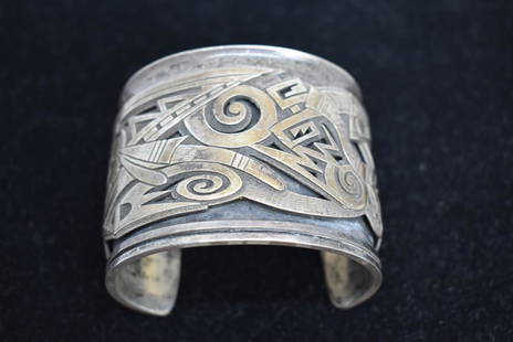 SIGNED LOMAWYWESA HOPI STERLING SILVER CUFF: INTERIOR LENGTH IS 5 5/8"--OPENING IS 1 5/8"--BRACELET IS 2 3/16" WIDE--MICHAEL KABOTIE