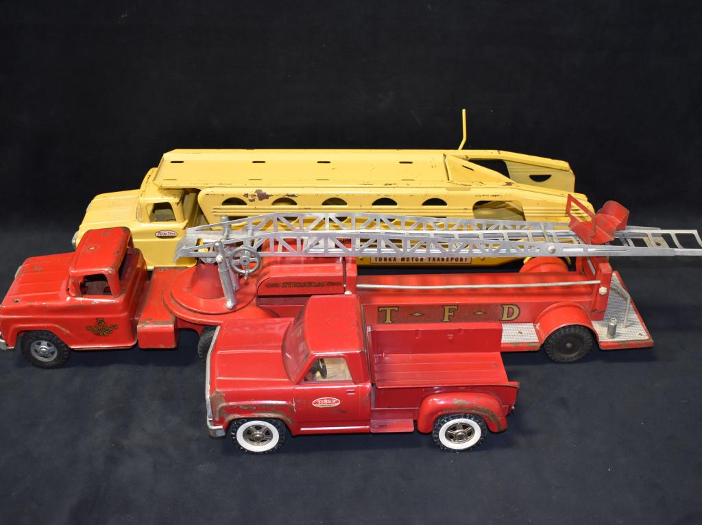 3 1950'S-1960'S TONKA TRUCKS: FIRE HOOK & LADDER TRUCK -- DUMP TRUCK -- CAR CARRIER