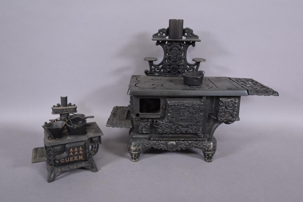2 SMALL CAST RION STOVES: QUEEN & ROYAL--ROYAL MISSING SMALL DOOR & TOP IS LOOSE