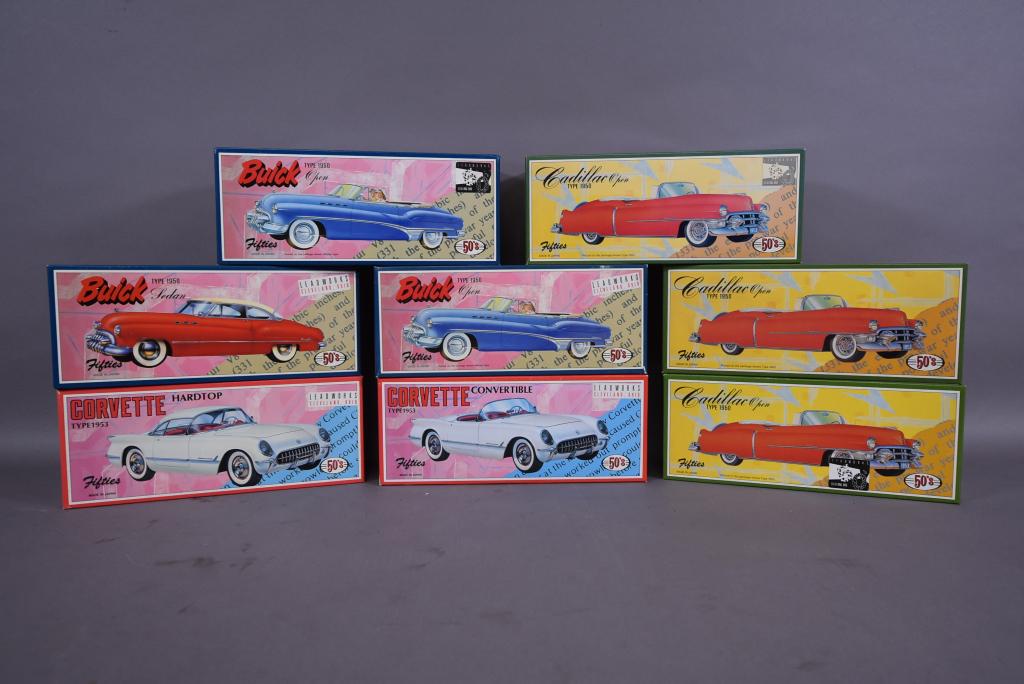 8 JAPANESE TIN FRICTION CARS IN ORIGINAL BOXES: 2 CORVETTES (1 COVERTIBLE)--3 CADILLACS--3 BUICKS