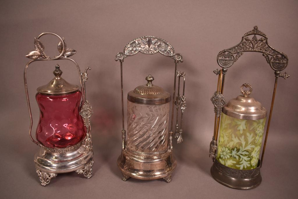 3 VICTORIAN GLASS & SILVERPLATE PICKLE CASTORS: ALL ARE APPROX. 12" TALL--CRANBERRY, VASELINE, & CLEAR