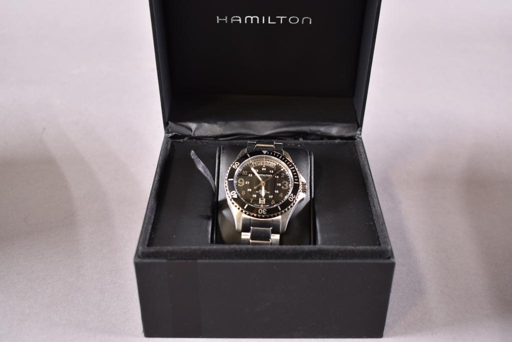 HAMILTON KHAKI KING SCUBA MENS WATCH: NOS -- MODEL # H64515133 -- STAINLESS STEEL CASE WITH A STAINLESS -- STEEL BRACELET. ROTATING STAINLESS STEEL BEZEL WITH BLACK ION-PLATED TOP RING. BLACK DIAL WITH LUMINOUS SILVER-TONE HANDS AND ARABI
