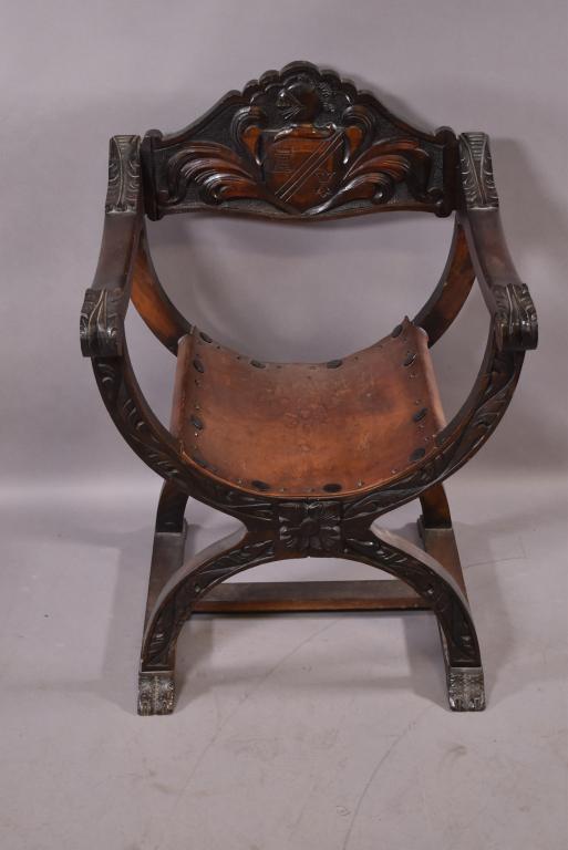 SPANISH STYLE SAVONAROLA ARM CHAIR: CARVED SHIELD BACK WITH LEATHER SEAT -- ORIGINAL FINISH -- 25" x 22" x 36" -- OVERALL GOOD CONDITION