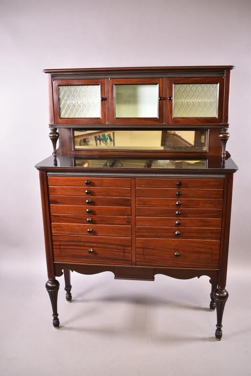 ANTIQUE MAHOGANY DENTAL CABINET: AMERICAN CABINET CO. -- 14 DRAWER WITH GLASS TOP & 3 UPPER GLASS DOORS -- ORIGINAL HARDWARE -- FINISH IN GOOD CONDITION -- REPAIRED FRONT LEG -- 40" x 14" x 57 3/4"