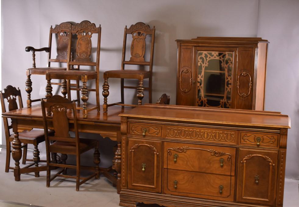 1930s 9 PIECE DINING ROOM SET: WALNUT DRAW LEAF TABLE WITH 6 CHAIRS -- BUFFET & CHINA CABINET -- WEAR TO FINISH ON ALL PIECES -- SOME VENEER CHIPS ON CHAIRS AND CHINA CABINET -- TABLE TOP HAS STAIN -- TABLE (57" x 38" x 30") -- BUF