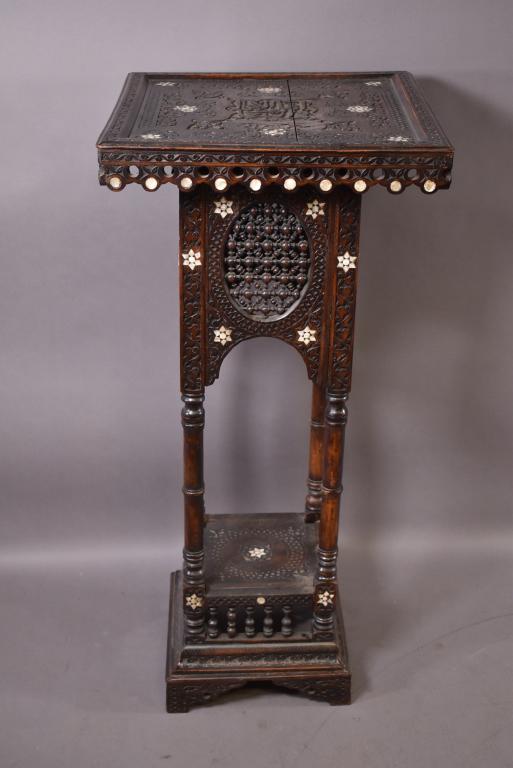 LARGE INLAID MOORISH PLANT STAND: HIGHLY CARVED WITH MOTHER OF PEARL INLAY -- SOME FINISH WEAR THROUGHOUT -- OVERALL GOOD CONDITION -- TOP IS 21" x 21" -- 44" H
