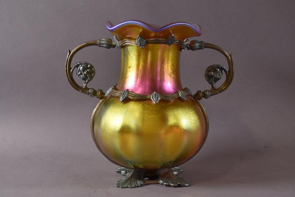 UNSIGNED LOETZ ART GLASS VASE W/ METAL DECORATION: METAL HANDLED AND FOOTED WITH GOLD AURENE GLASS-- NO CHIPS, CRACKS, OR BREAKS -- 8 3/4" H