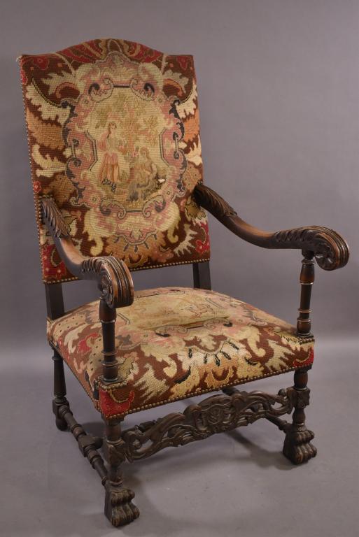 1920'S HIGHLY CARVED HALL CHAIR WITH NEEDLEPOINT: NEEDLE POINT UPHOLSTERY -- SMALL TEAR IN SEAT BACK -- SMALL REPAIR TO FRONT LEFT LEG -- SLIGHTLY WORN FINISH -- 26 1/2" x 30" x 47 1/2"