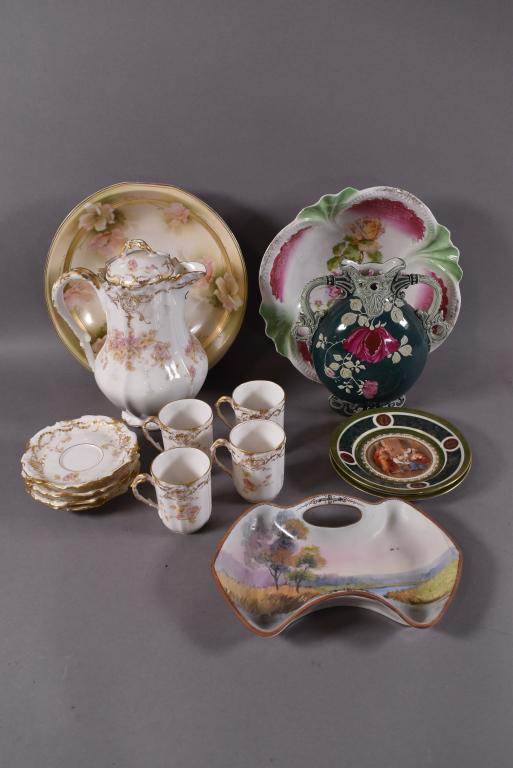 GROUPING OF MISC PORCELAIN INCL: LIMOGES & PRUSSIA: LIMOGE CHOCOLATE SET WITH PITCHER AND 4 CUPS -- 2 ROYAL VIENNA PORTRAIT SMALL PLATES -- 2 R.S. BOWLS (1 IS PRUSSIA) -- 2 PCS NIPPON -- ALL GOOD CONDITION
