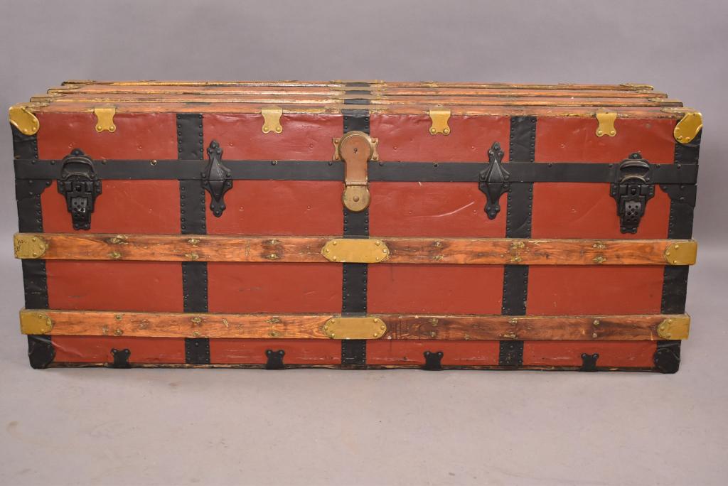 ANTIQUE METAL AND WOOD TRUNK: BRASS HARDWARE WITH PAINTED RED FINISH -- GOOD CONDITION -- MISSING HANDLES ON SIDES -- 53 1/2" x 17" x 22"