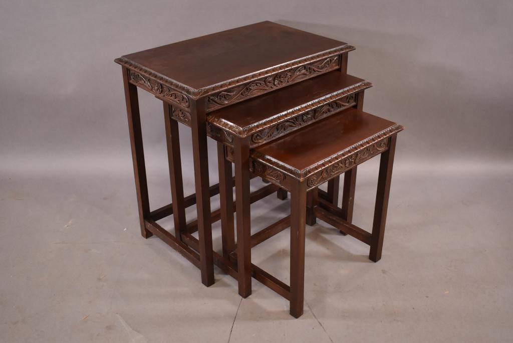 1930'S CARVED WALNUT NESTING TABLES: MINOR WEAR TO FINISH -- CARVED AROUND EDGE -- 24" x 16" x 25"