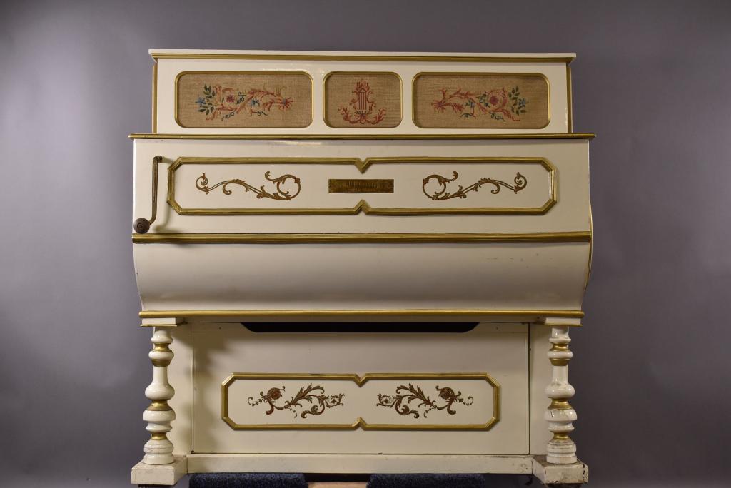 LUIS CASALI SPANISH STREET ORGAN: PAINTED WITH FLORAL DESIGN, NEEDLE POINT INSERTS. SOME PAINT LOSS, MINOR SPLITS TO WOOD. WORKS, NEEDS TUNED. 49" W X 28" X 49"