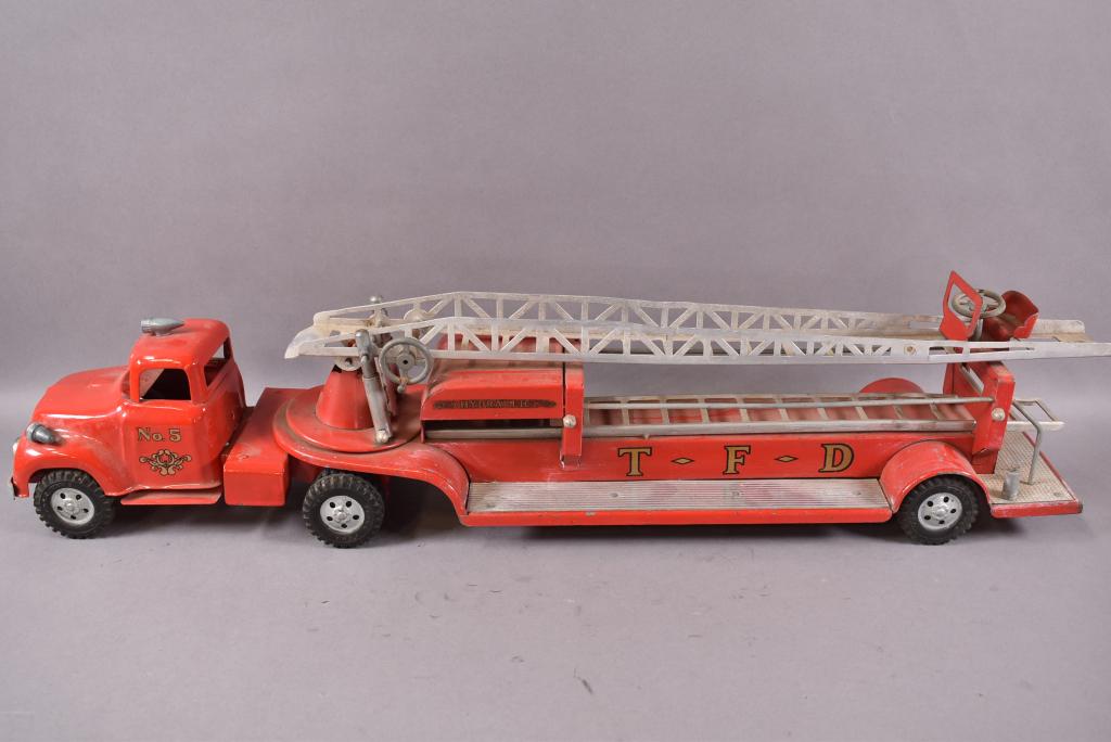 1950s TONKA HOOK AND LADDER FIRE TRUCK: 31 1/2" L, FRONT END HAS BEEN REPAINTED, PLAYED WITH CONDITION