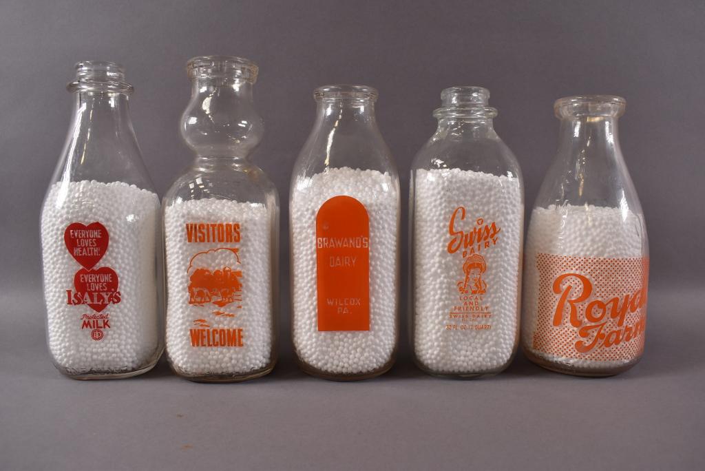 5 VINTAGE QUART MILK BOTTLES: 9 1/2" H. ISALYS, PEERLESS, BRAWANS, SWISS, ROYAL. GOOD CONDITION NO CHIPS CRACKS OR BREAKS.