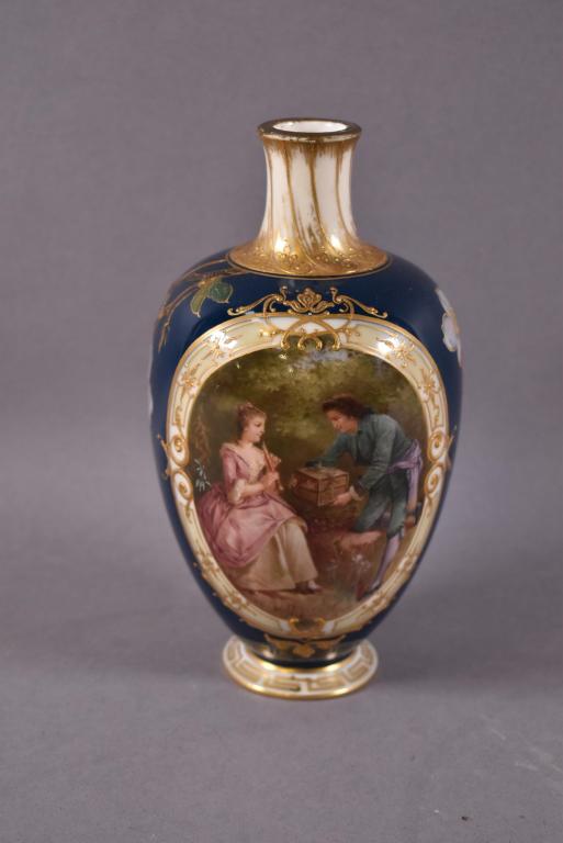 KPM HAND PAINTED PORTRAIT VASE: 19TH C. VASE WITH MAN AND WOMAN WITH FLOWERS APPLIED IN RELIEF. MARKED ON BASE WITH BLUE MARK AND KPM VS. TOP APPEARS TO BE REPAINTED GOLD. 7 3/4" H