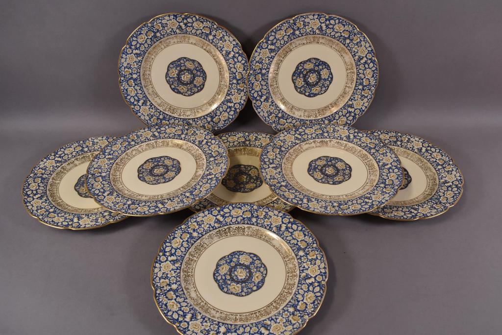 SET OF 8 BAVARIAN DINNER PLATES: BLUE AND GOLD FLORAL PATTER. SOME PAINT LOSS TO GOLD ON PLATES. OVERALL GOOD CONDITION. 11" DIAM