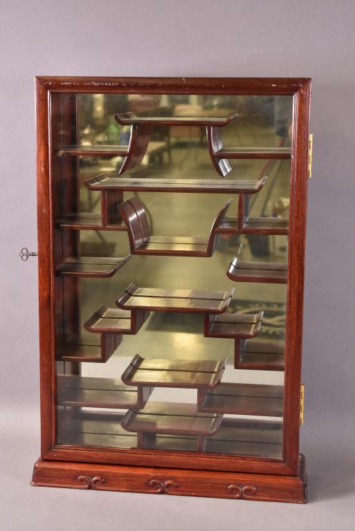 CHINESE HARDWOOD HANGING CABINET: GOOD CONDITION, WITH KEY. MIRRORED BACK. 17" x 5" x 25"