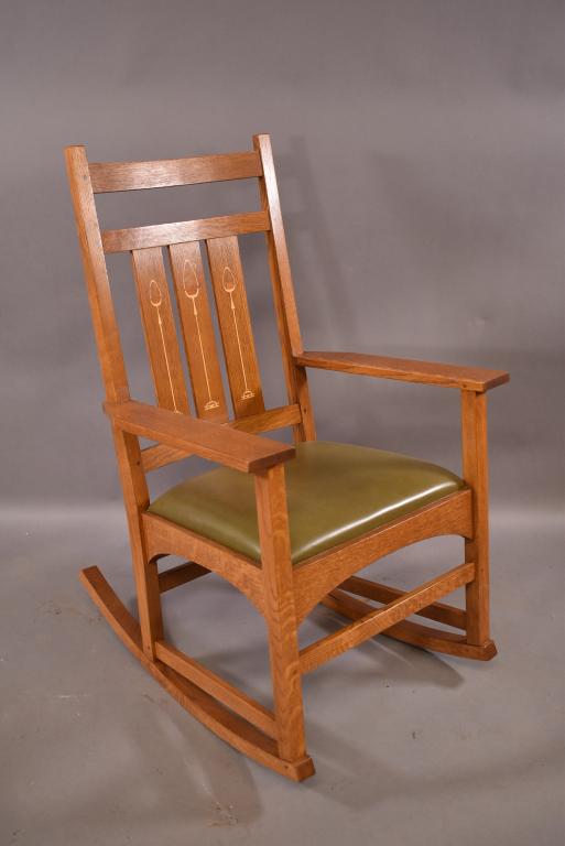 HARVEY ELLIS INLAY OAK ROCKER BY STICKLEY: CONTEMPORARY STICKLEY ROCKER 89-353. ORIGINAL DROP IN CUSHION SIGNED ON INSIDE BOTTOM. SOME WEAR TO SEAT. FINISH IN GOOD CONDITION. 26" x 31" x 41"