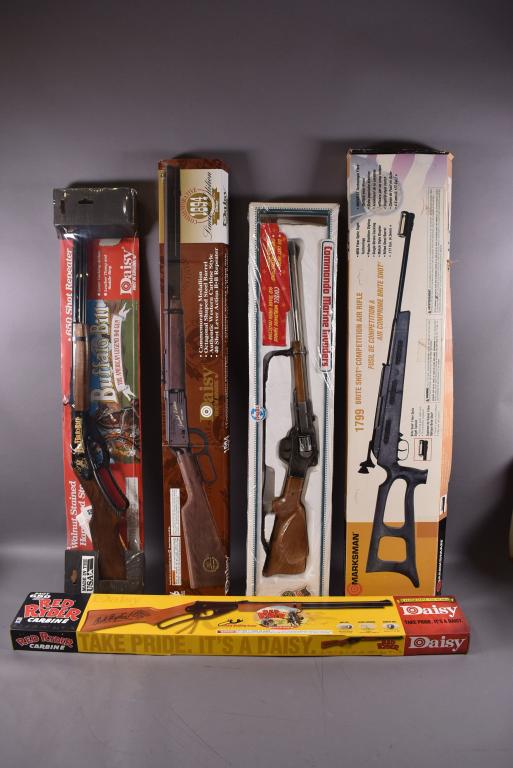 LOT OF 4 BB RIFLES & CAP RIFLE IN ORIGINAL BOXES: DAISY BUFFALO BILL, DAISY 1894 LIMITIED EDITION, DAISY RED RYDER, MARKSMAN 1799 BRITE SHOOT, & COIBEL COMMANDO MARINE INVADERS (CAP GUN)