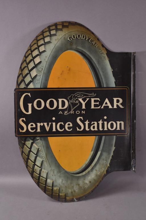 Early Goodyear Service Station Sign (TAC): Metal die cut flange sign has good color and shine, display has light wear and a few fine scratches, reverse is faded slightly, marked Property of Goodyear Tire & Rubber Co., 27"x18", rated 8.25 & 7.2