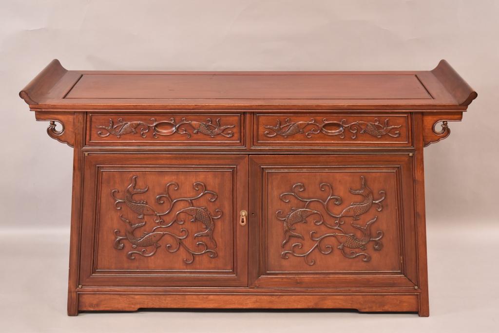 CHIENSE HARDWOOD ALTER CONSOLE CABINET: CARVED FISH DESIGN ON DOORS AND DRAWERS. MISSING ONE PULL ON RIGHT DOOR. FINISH IN GOOD CONDITION. 56" x 18" x 32"