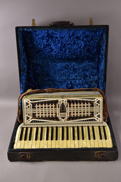 MORESCHI & SONS ACCORDIAN: IN ORIGINAL CASE, APPEARS TO BE IN WORKING CONDITION, 16" x 17"