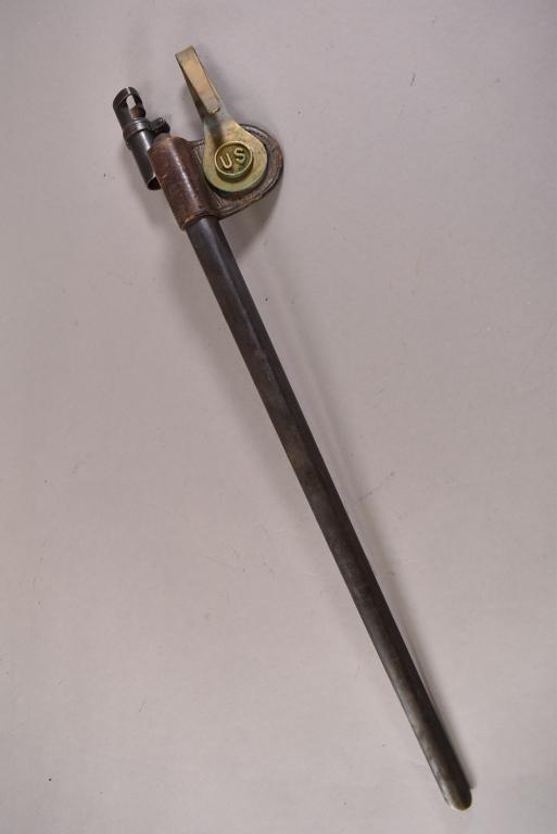 1873 SPRINGFIELD TRAPDOOR RIFLE BAYONET: SOCKET BAYONET WITH ORIGINAL METAL SCABBARD. WITH US MEDALLION. MARKED US ON BLADE AND SCABBARD. 21" L